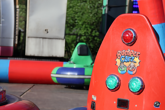Colourful bouncy castle with buttons and bright inflatable elements.